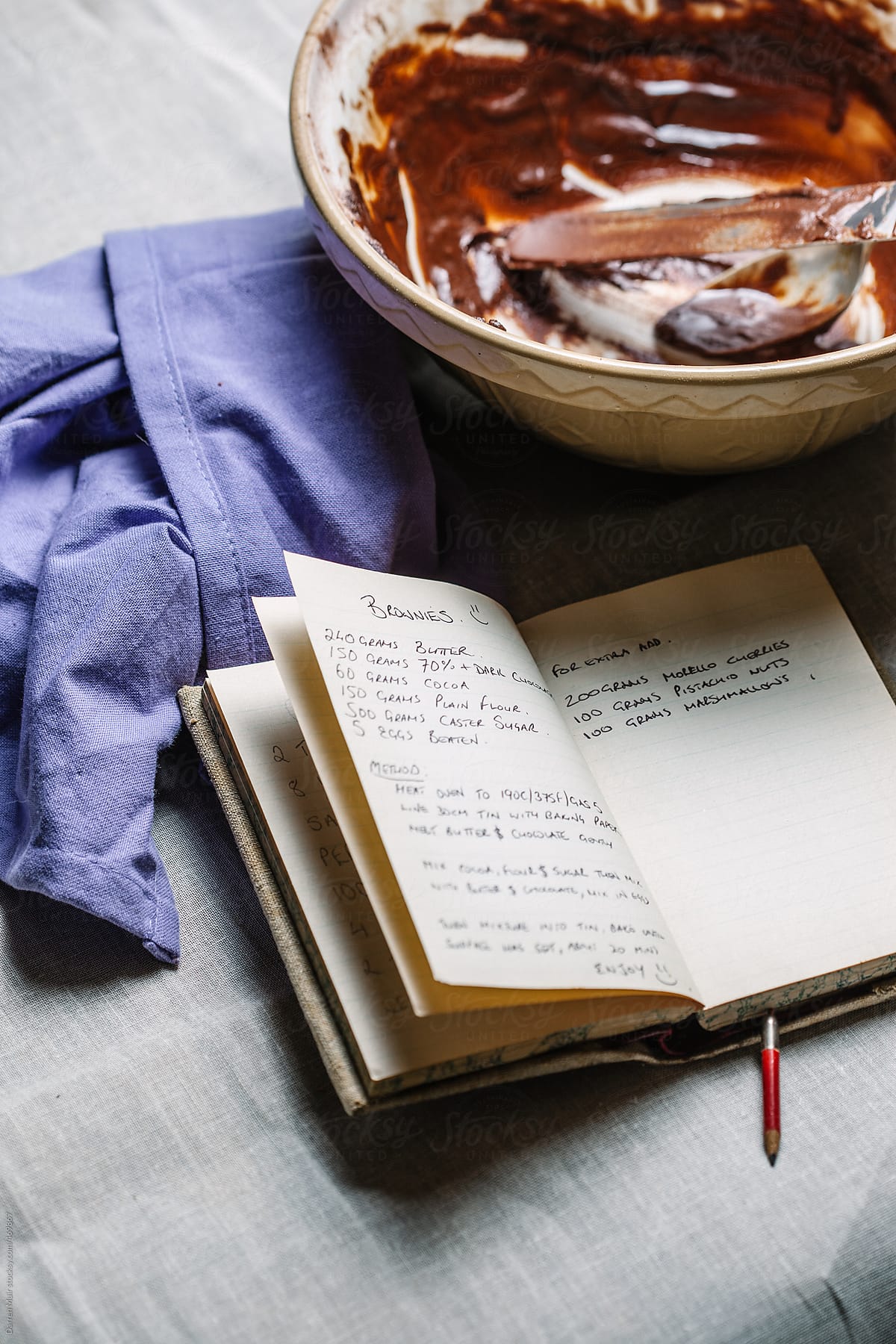 Chocolate brownie recipe in handwritten recipe book.