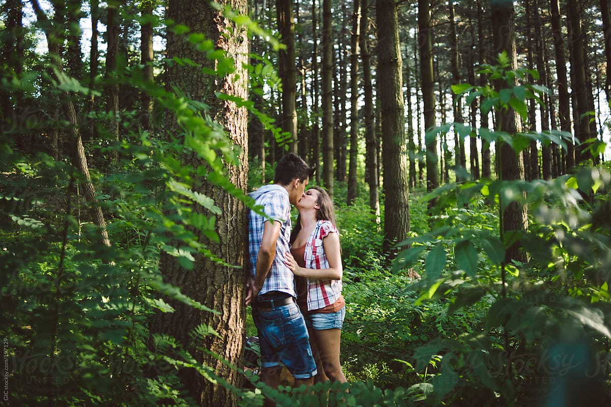 Affectionate Young Couple Kissing In The Forest During A -3261