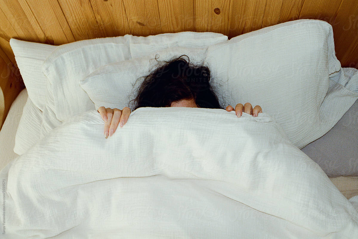 A woman under the blanket