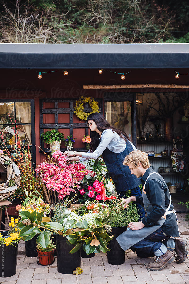 Flower shop storefront with employees
