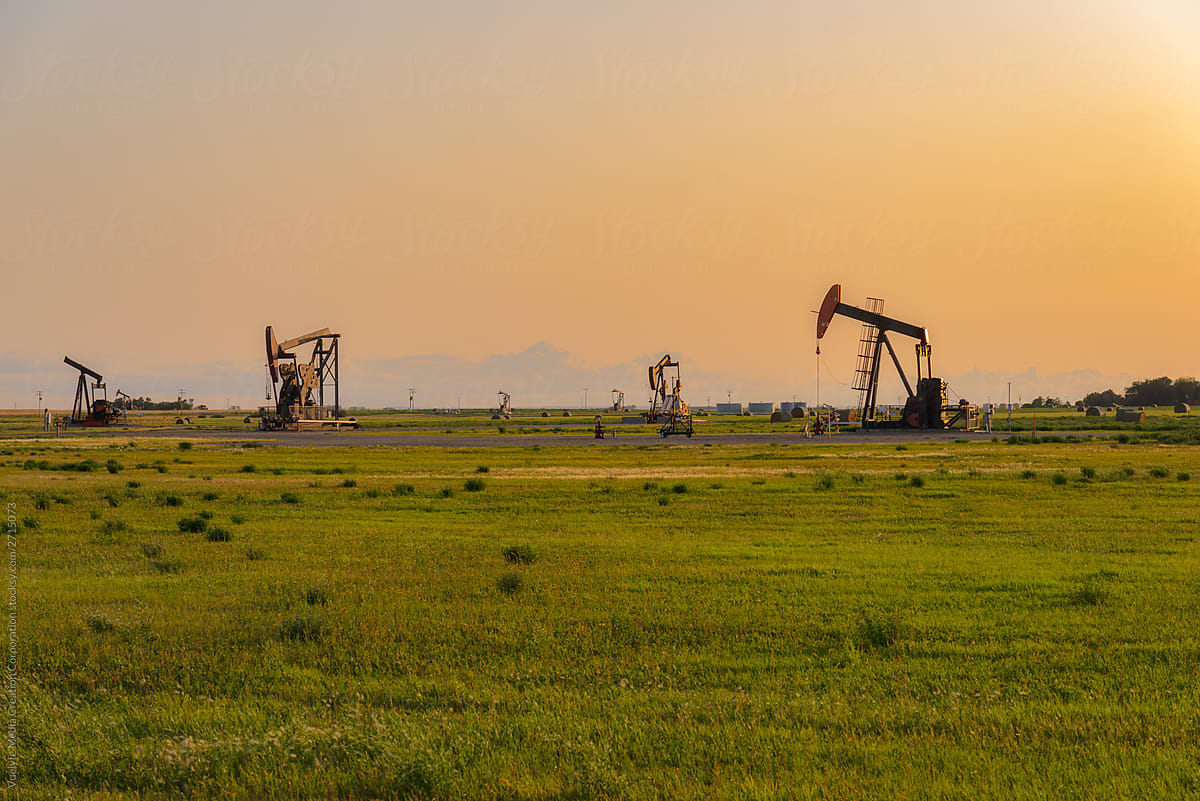 oil field pump in sunset