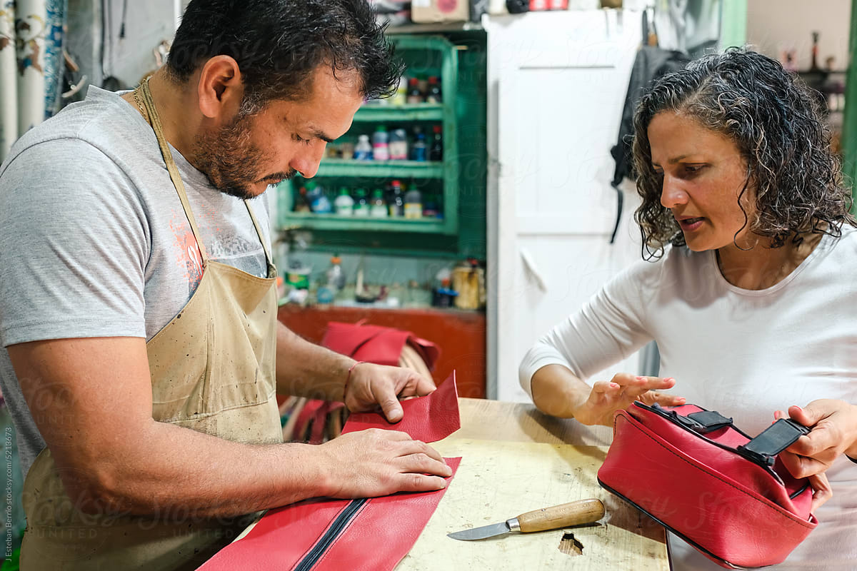 Craftsmen making a leather bag