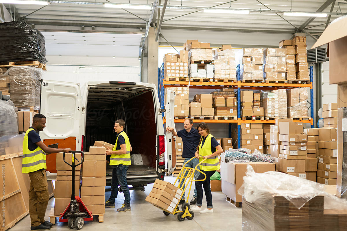 Busy Warehouse Workers Loading Delivery Van