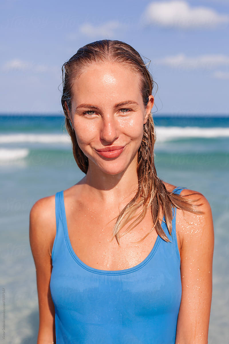 Fresh wet natural healthy woman face on the beach