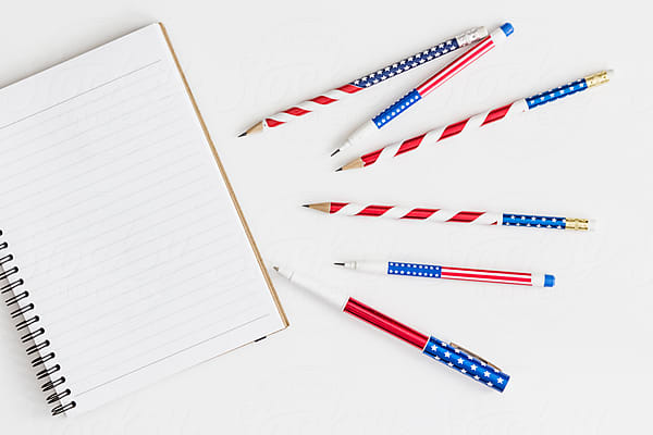 Stars And Stripes Pencil Among White Office Supplies by Stocksy  Contributor Melanie Kintz - Stocksy
