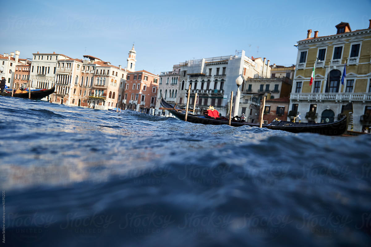 High tide flood waters in Venice overflow Grand Canal