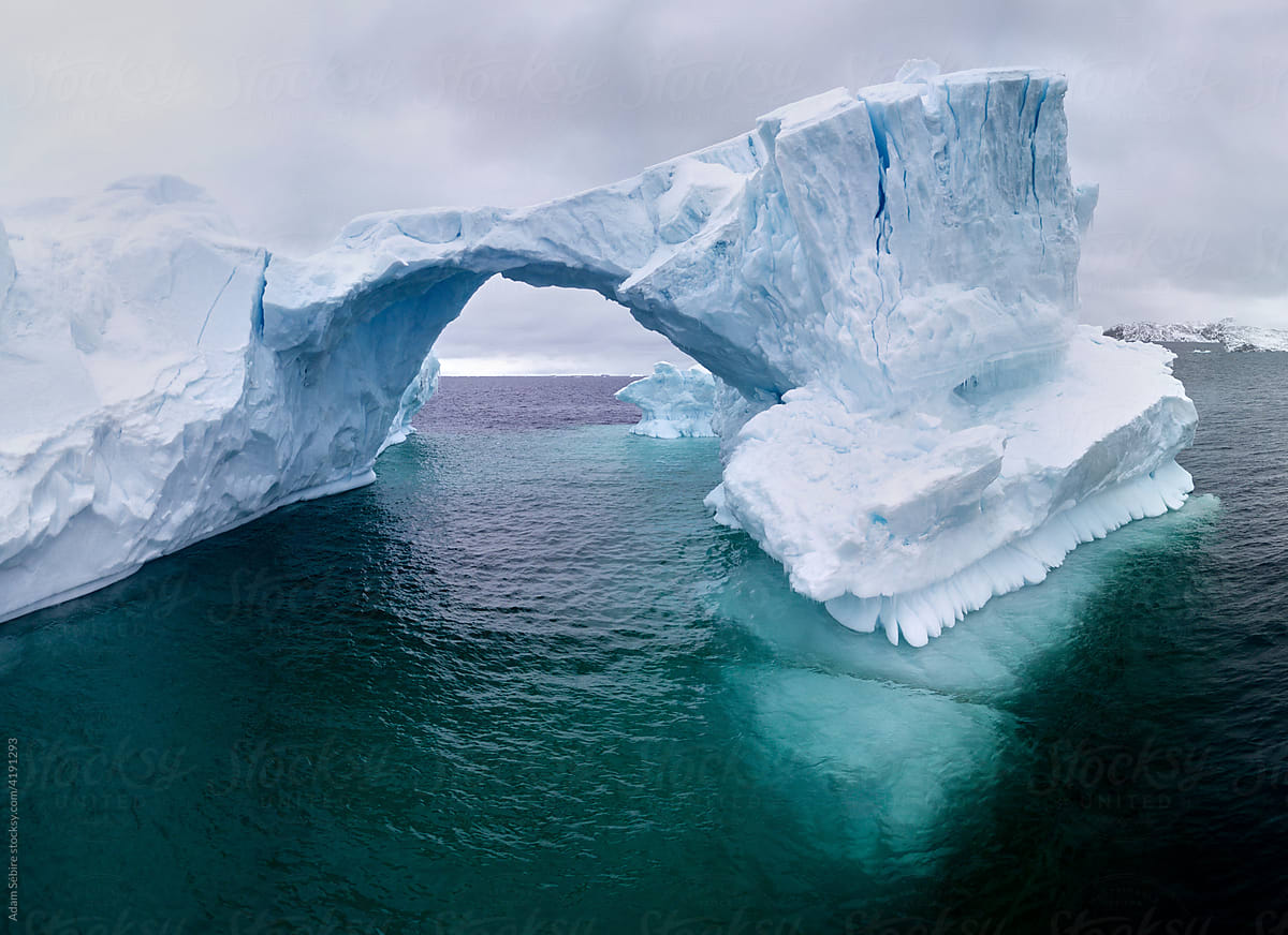 Amazing iceberg arch fracture in Arctic, climate change