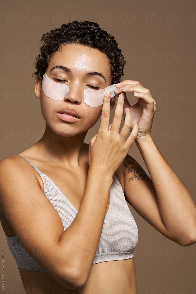 African American woman with cosmetic patches on face
