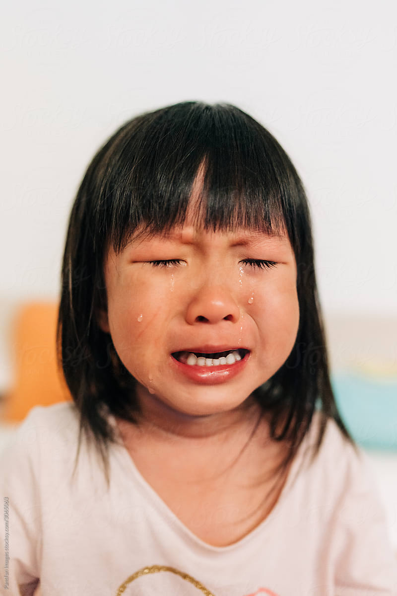 Asian little girl crying with tears in her face