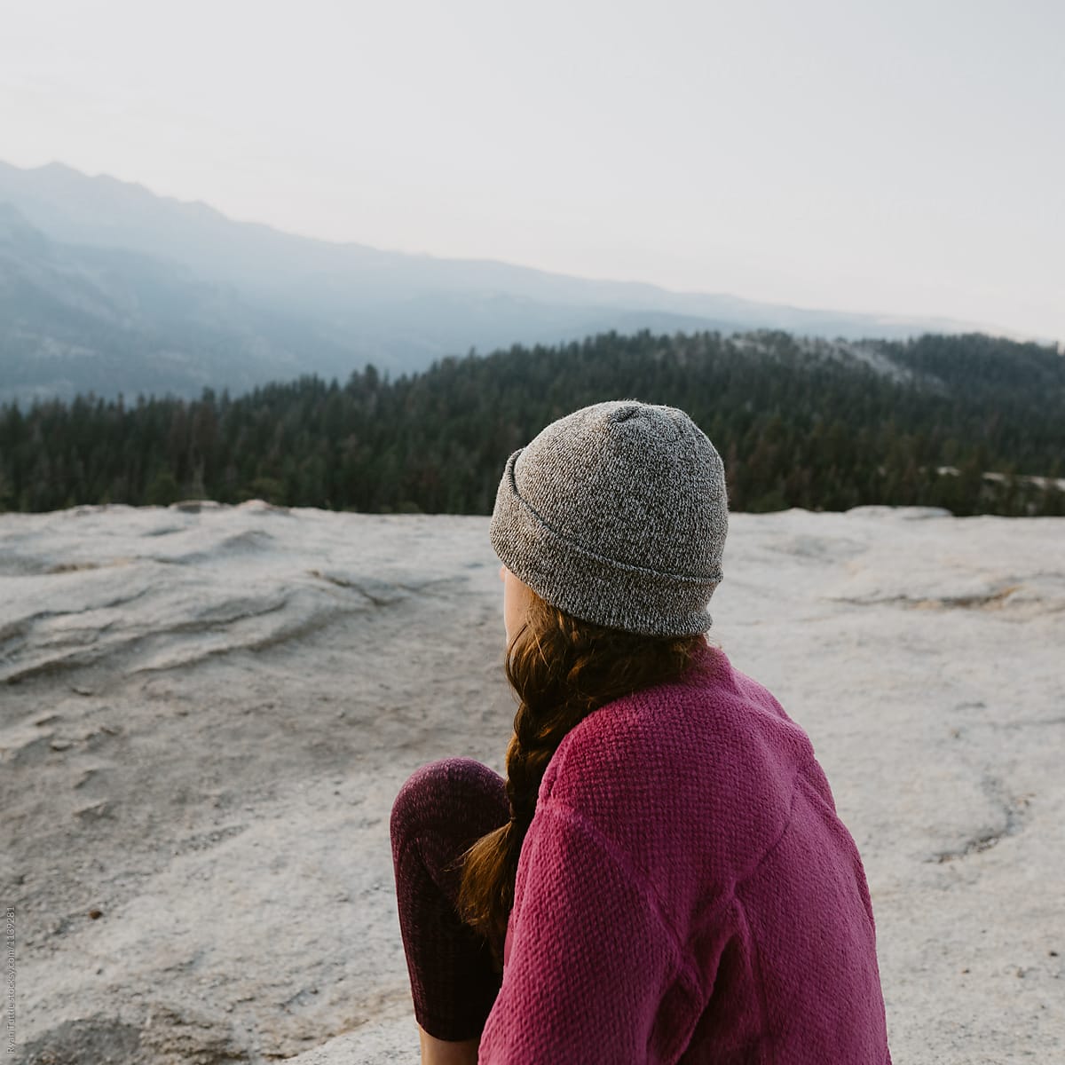 A woman watching the sunrise on Sentinel Dome