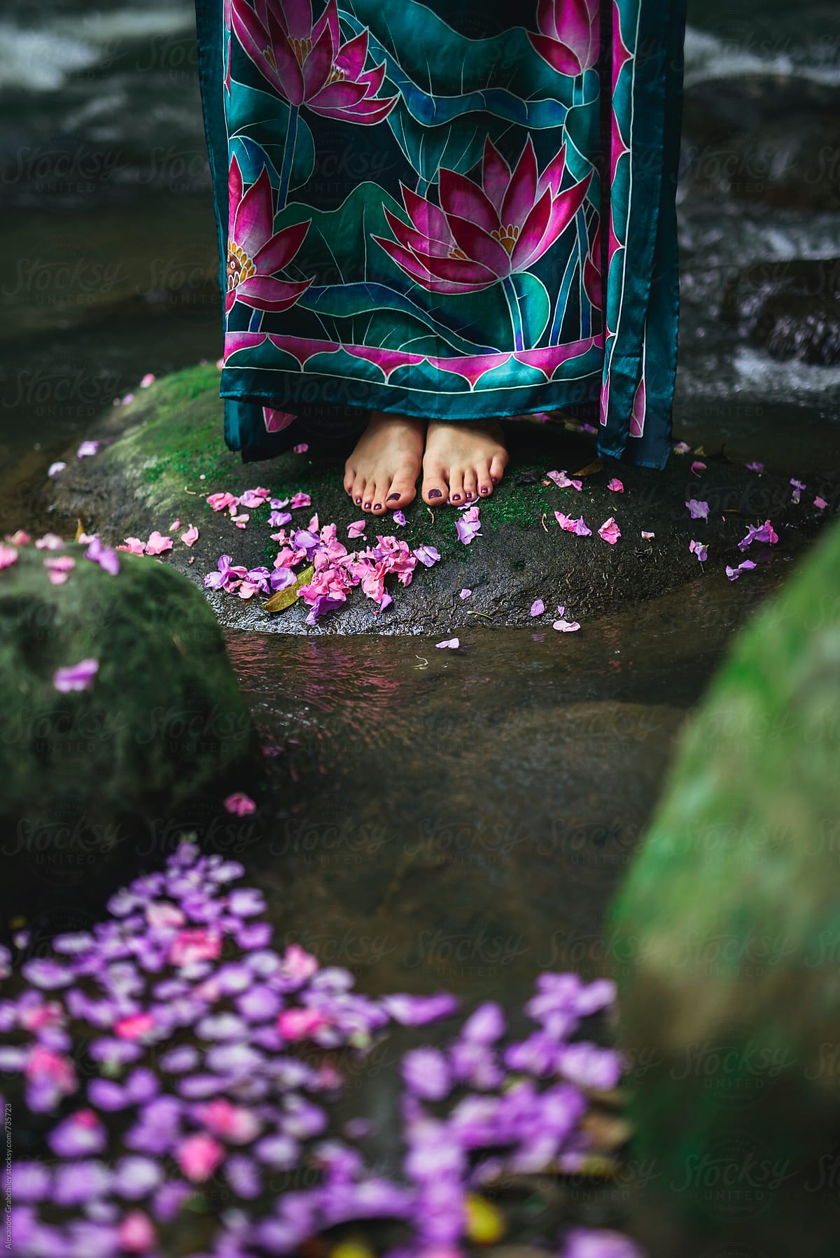 Woman Stands Barefoot On A Stone At A River