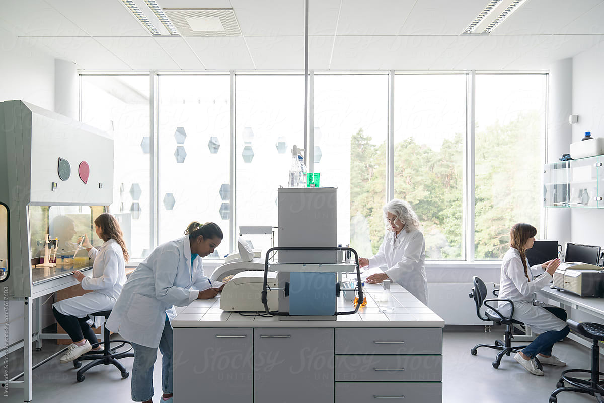 Four Female Scientists Working In Modern Laboratory