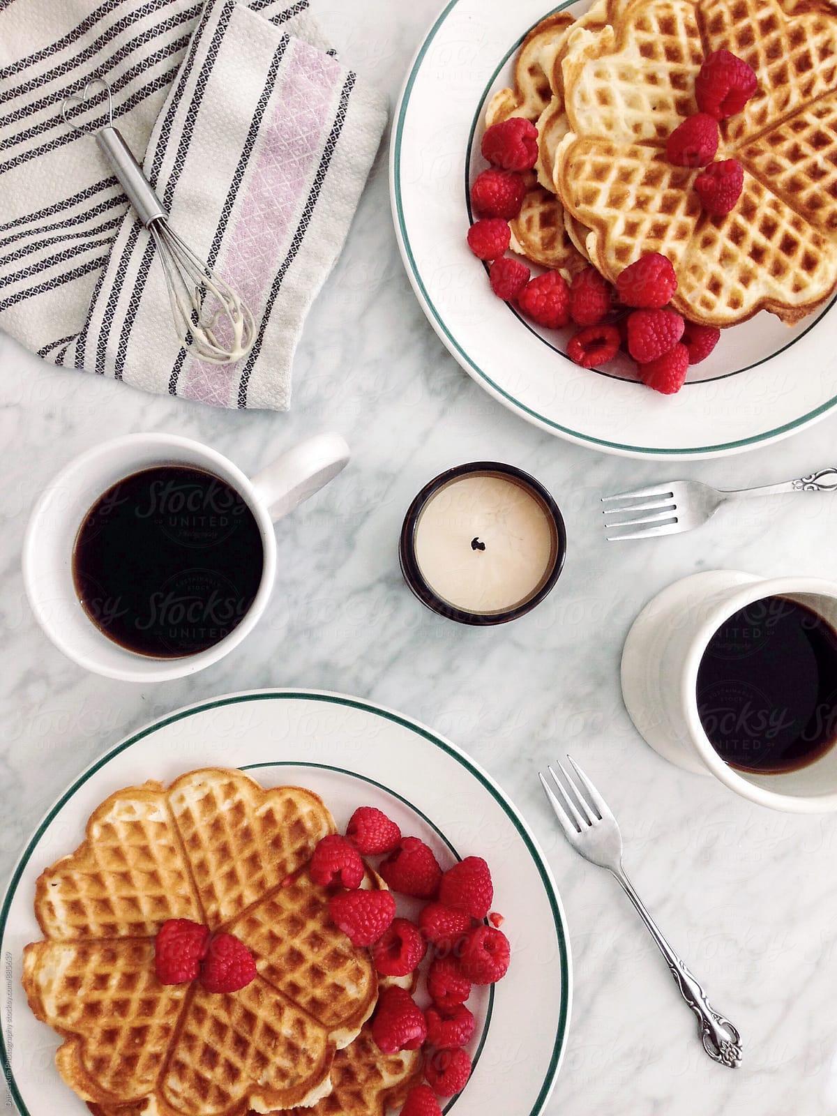 Waffles and coffee on table