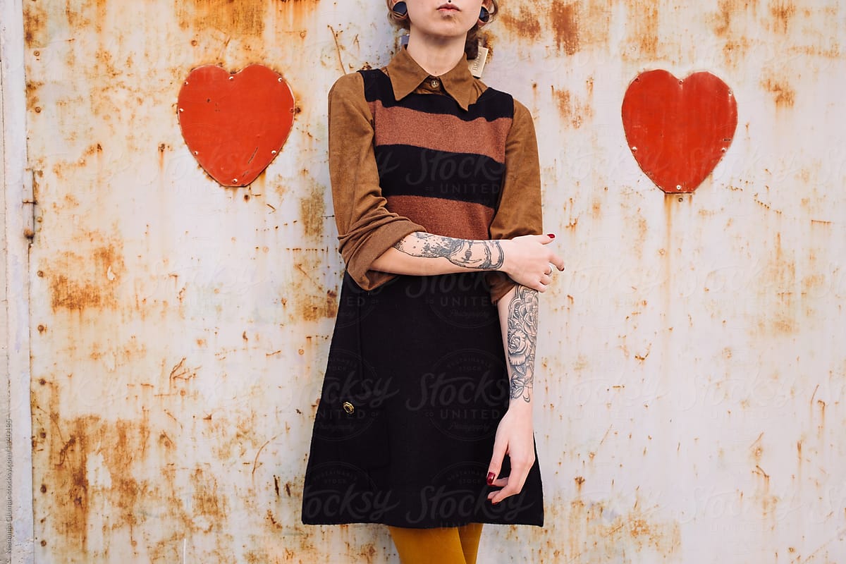 Unrecognizable Tattooed Woman Standing Between Two Hearts