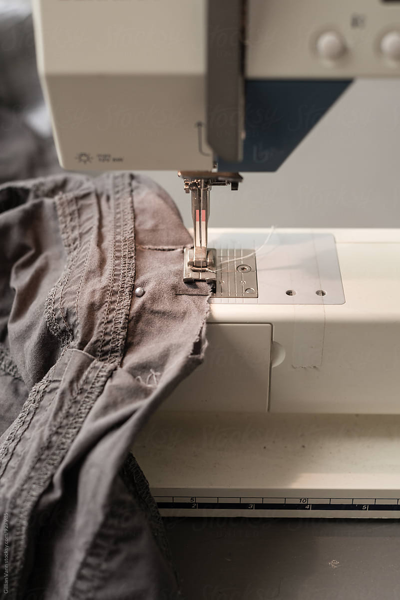 mending clothes with sewing machine