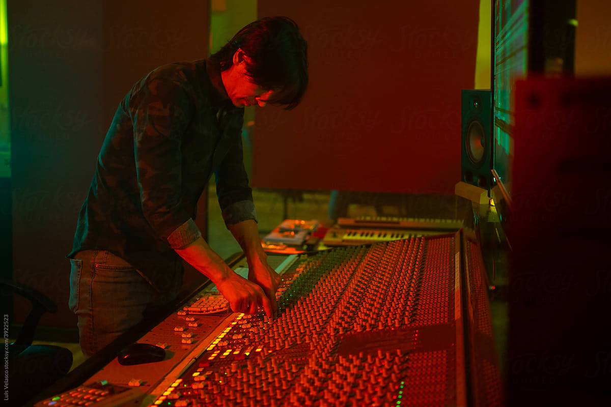 Sound Engineer Works With A Mixer Sound Desk.