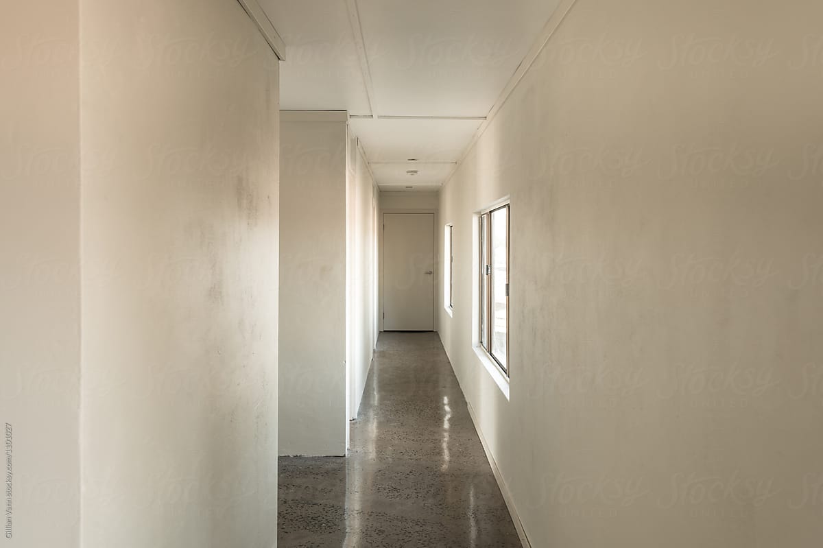dormitary style accommodation, empty hallway leading to bedrooms