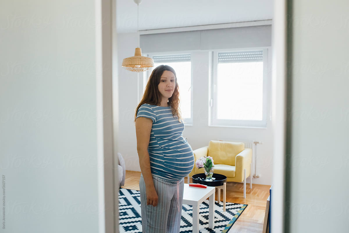 Pregnant woman cozy at home
