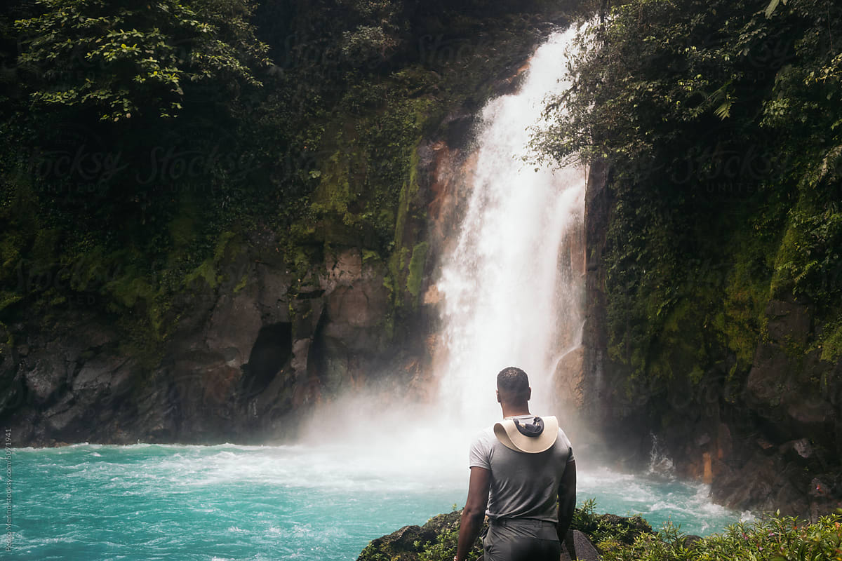 Man visiting the Rio Celeste waterfall in Costa Rica