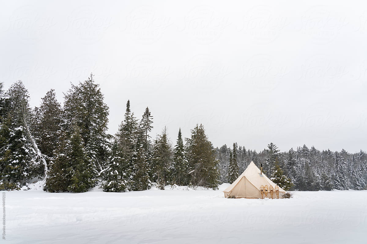 Snowy Winter Tent Campsite with Snowshoes