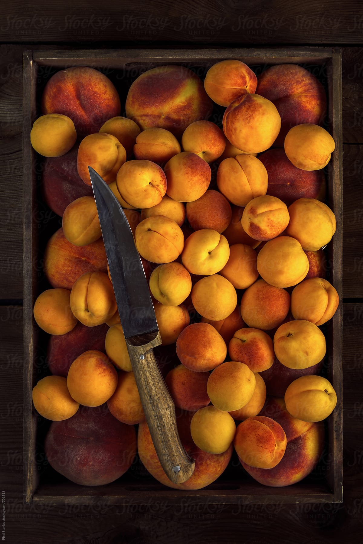 Peaches and apricots in a crate