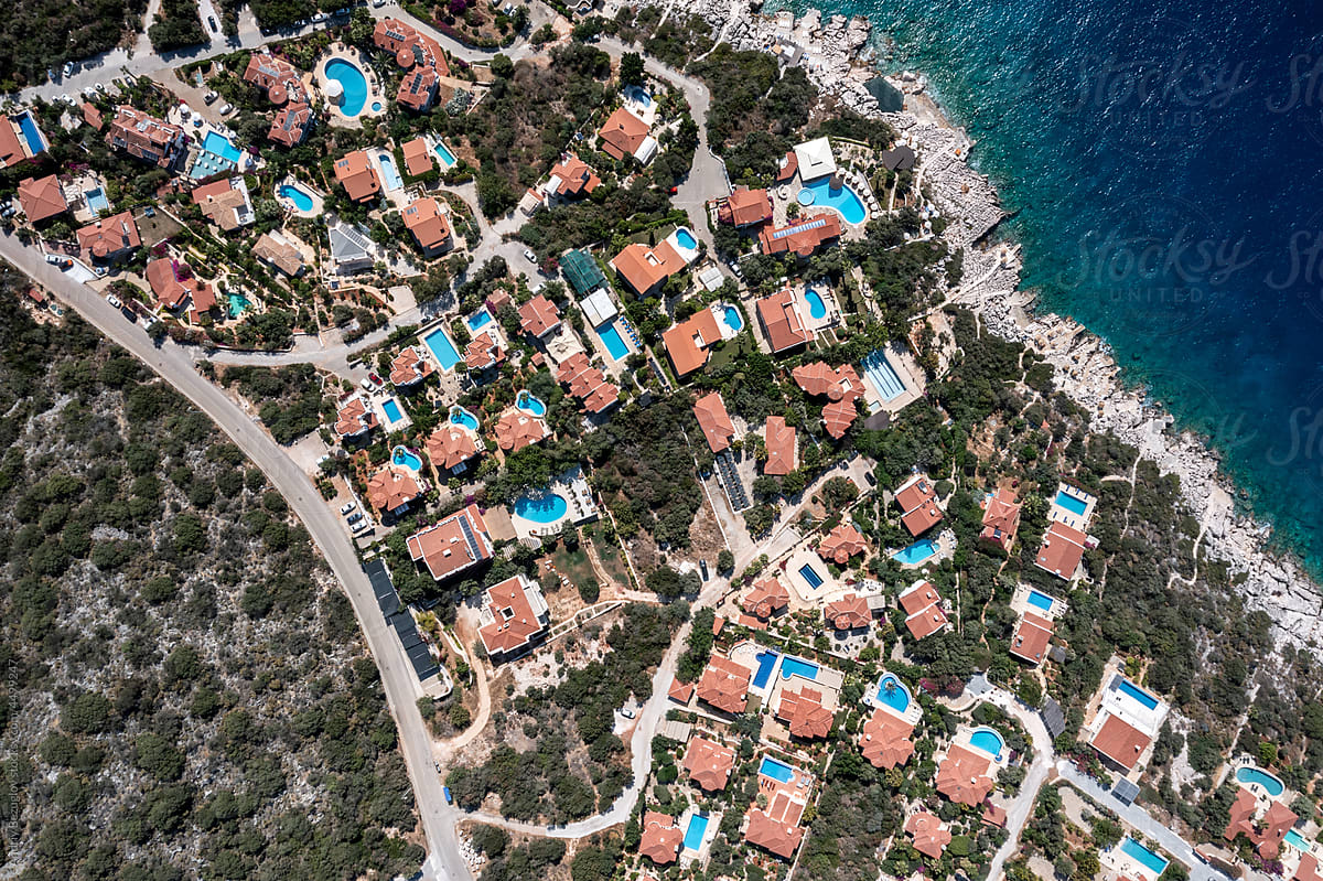 Panoramic top view at seashore with colorful villas