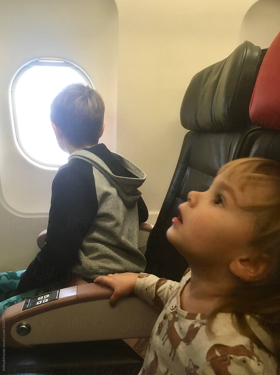 child sleeping on the airplane