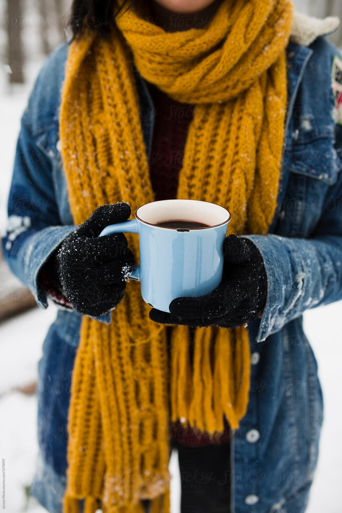 Young woman drinking mulled wine on a cold wintery day