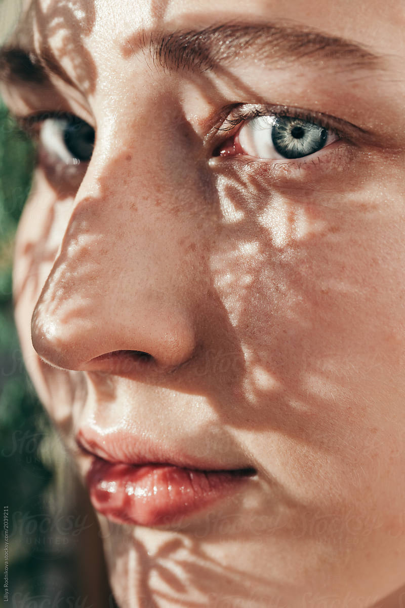 Closeup Portrait Of Amazing Girl With Floral Shadows On Her Face Del Colaborador De Stocksy 8272