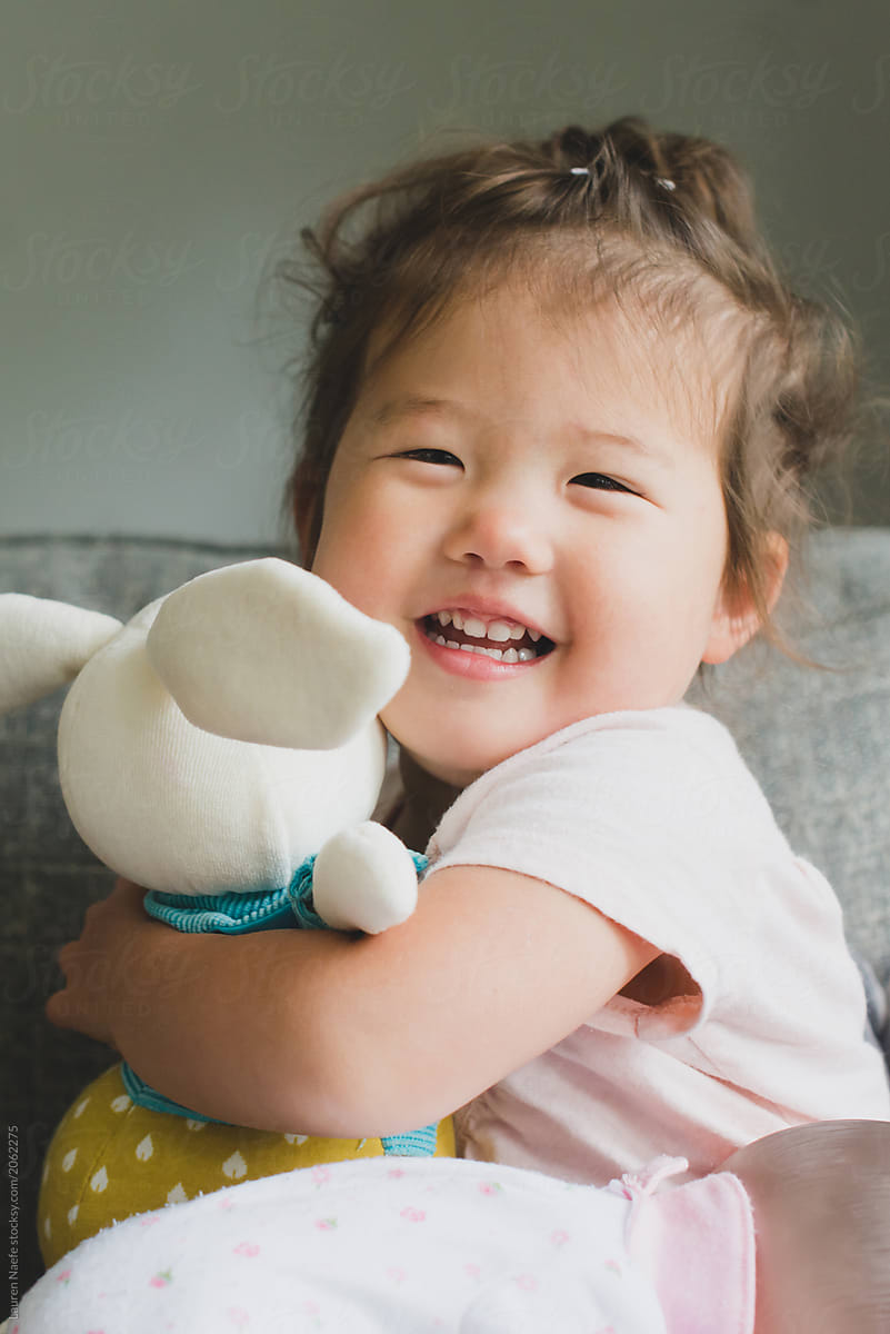 Baby holding stuffed animal