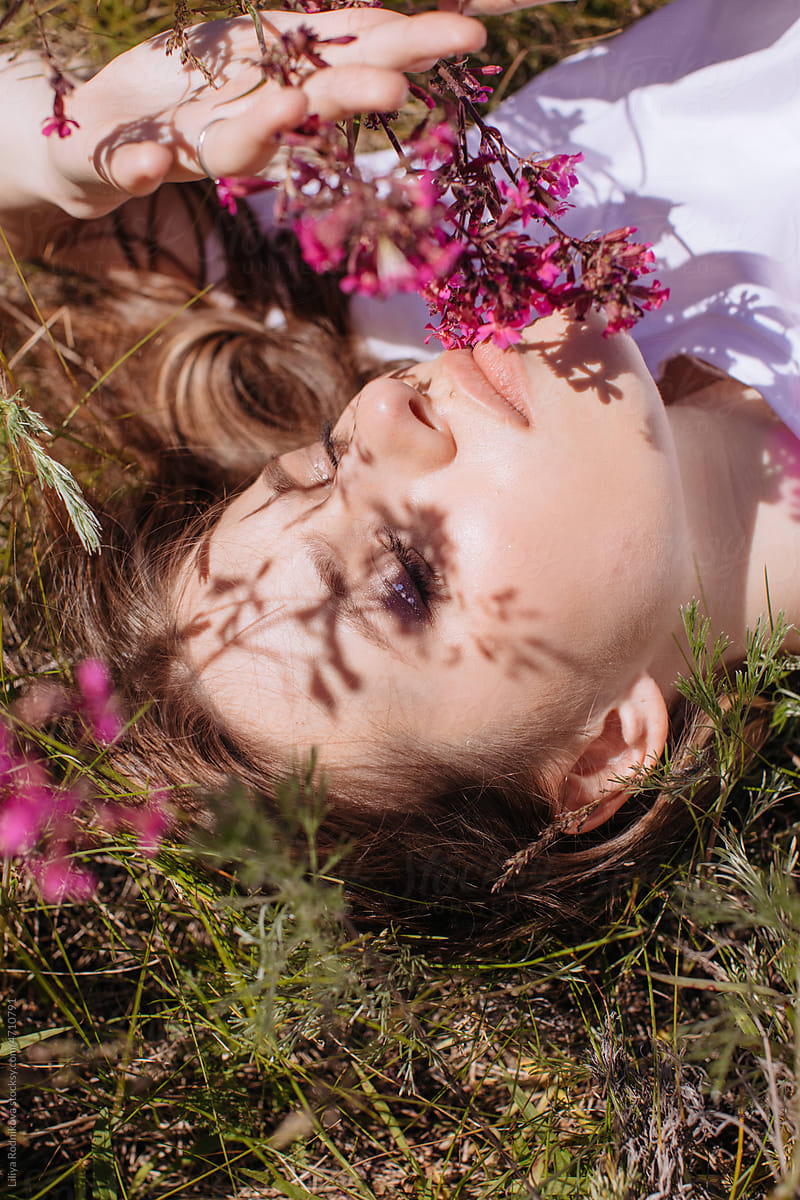 Dreamy woman with floral shadow on face