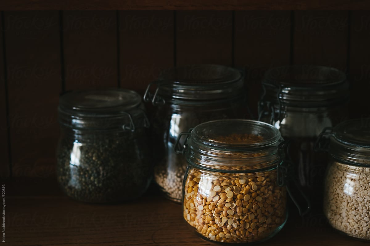 Lentils and other dry goods in glass storage jars.