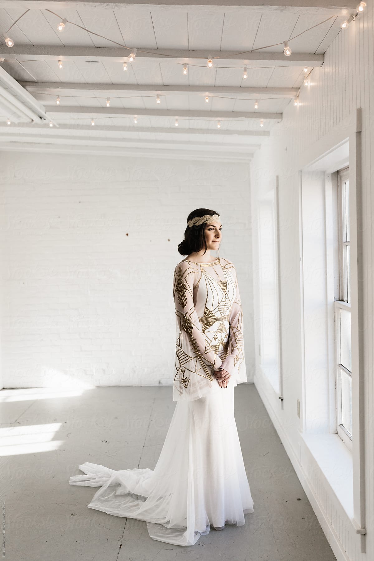 portrait of bohemian styled bride in white warehouse