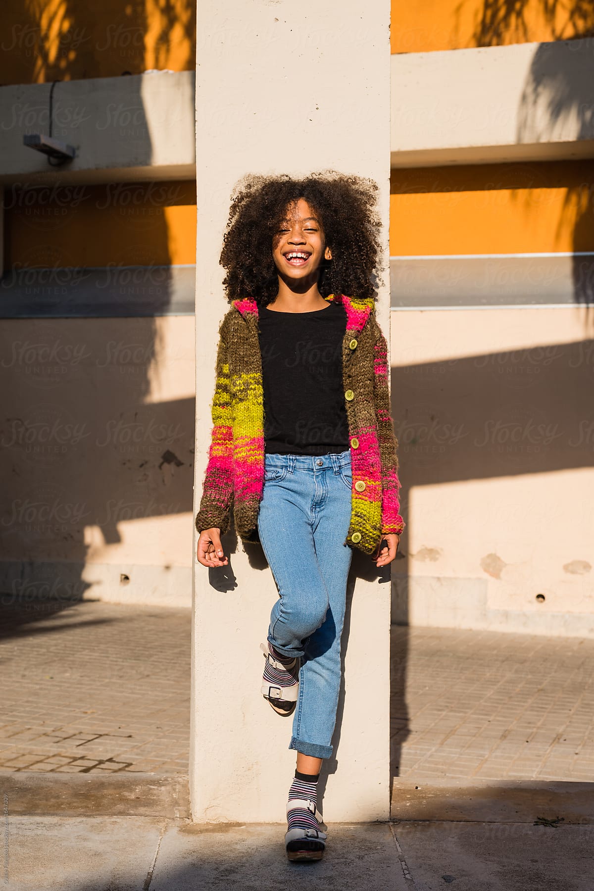 Cheerful Girl At Column By Stocksy Contributor Guille Faingold Stocksy