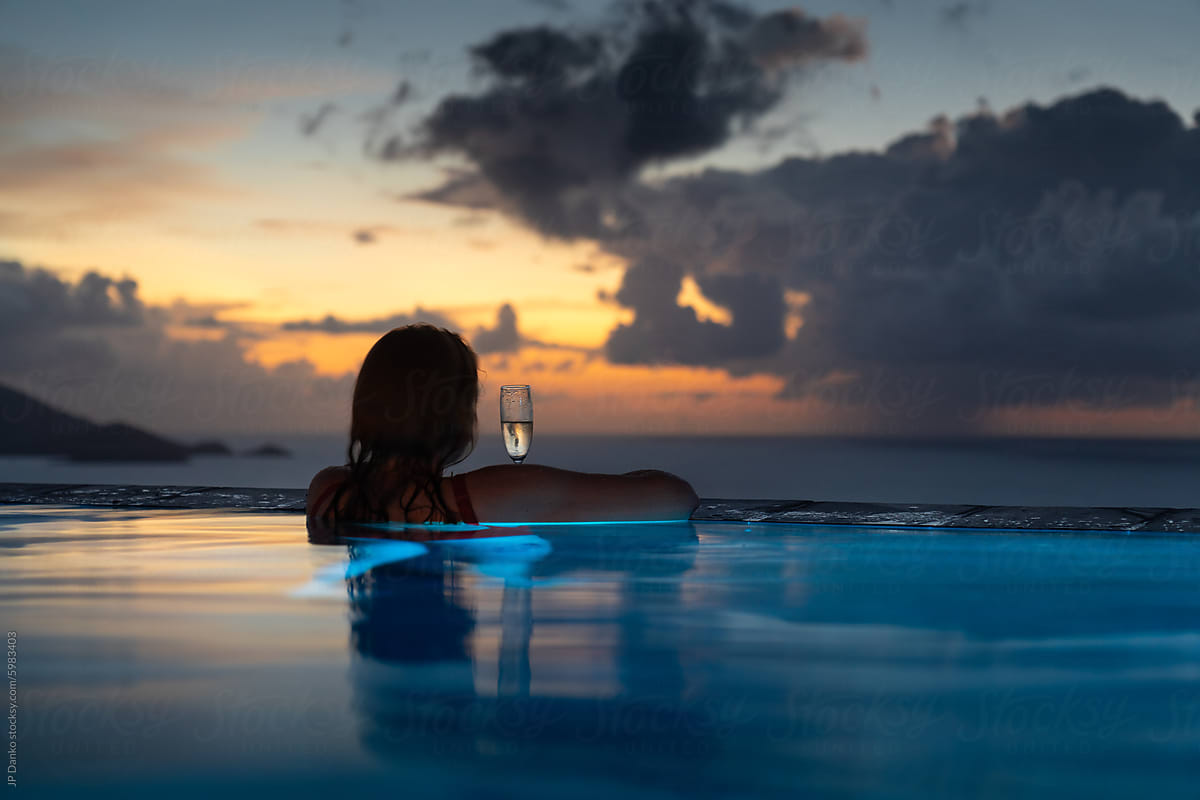 Woman with Tropical Sunset at Luxury Caribbean Villa