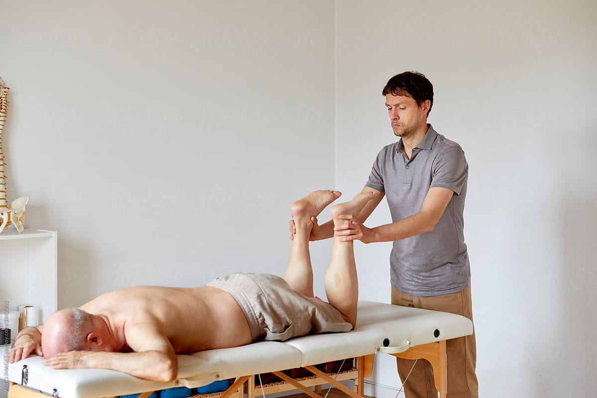 An osteopath giving treatment to a patient