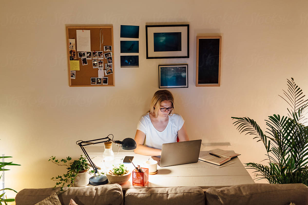 Woman Working On A Laptop From Home