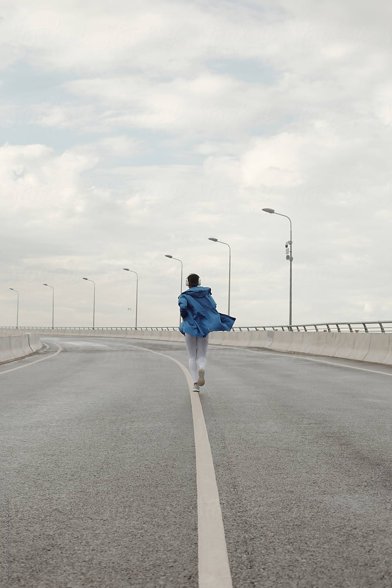 Woman Running On Highway