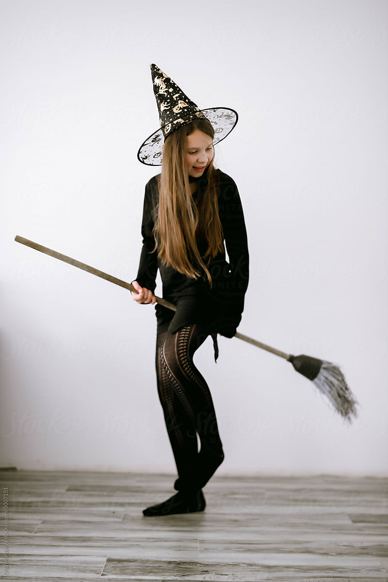 witch on a broomstick at home