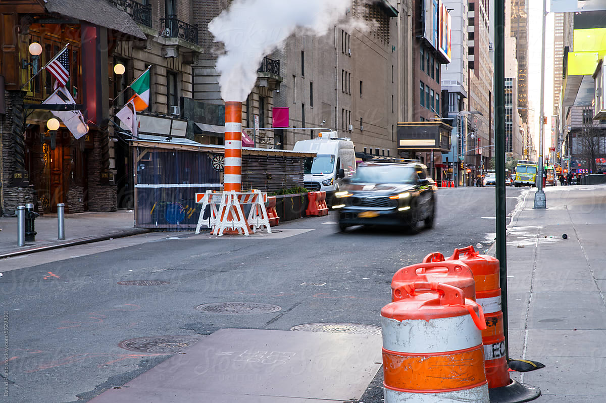 Manhattan morning rush with taxi and rising steam