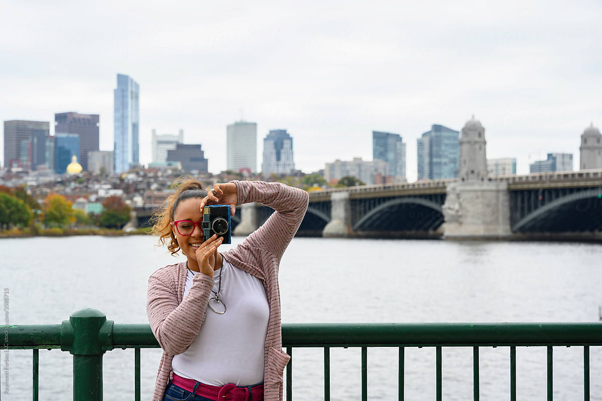 Young African American  Student Photographer with Boston Skyline