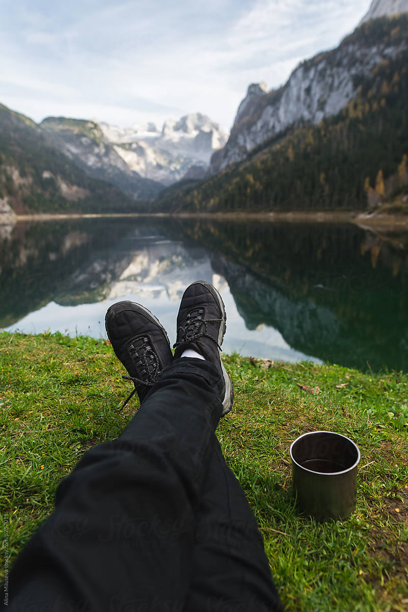 Anonymous Man Resting Near Scenic Alpine Lake