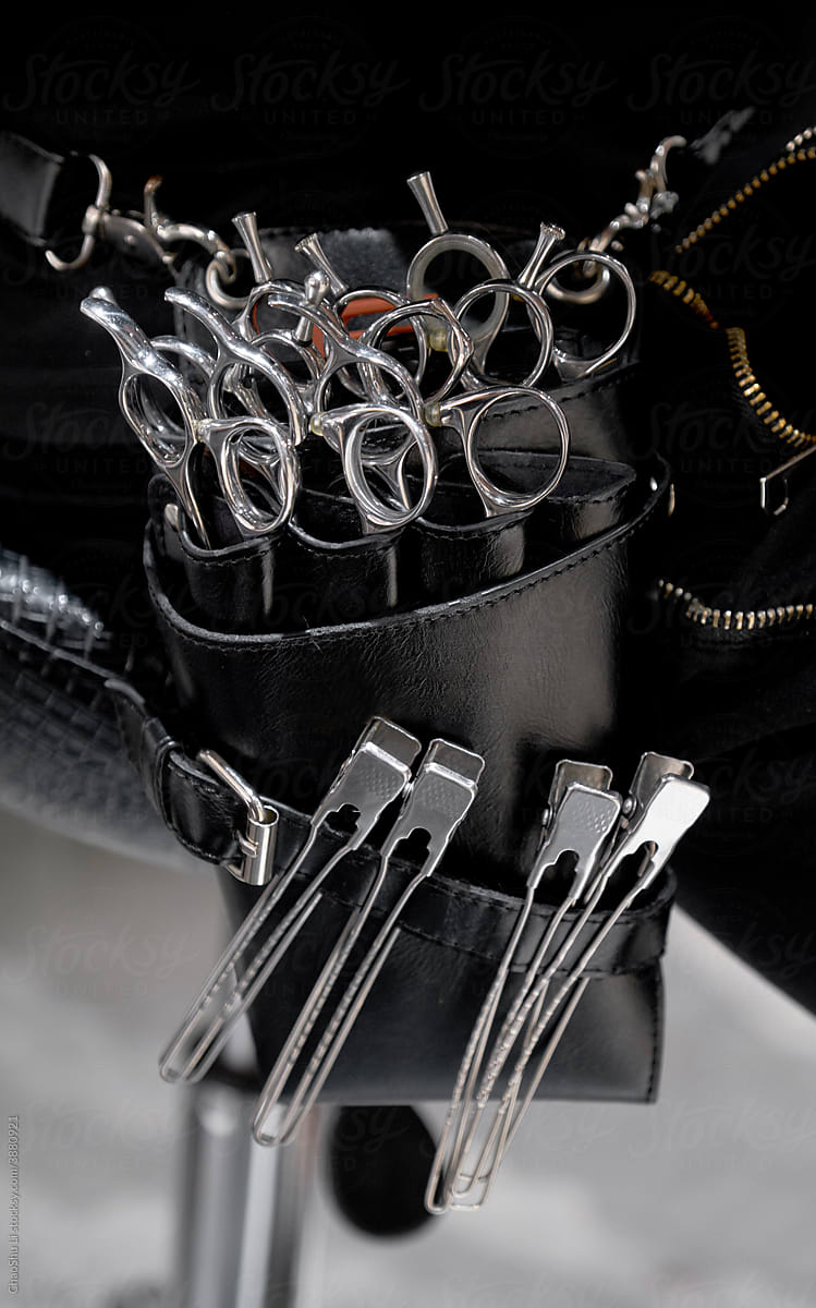 Close-up of neatly laid barber tools in barber\'s tool pocket