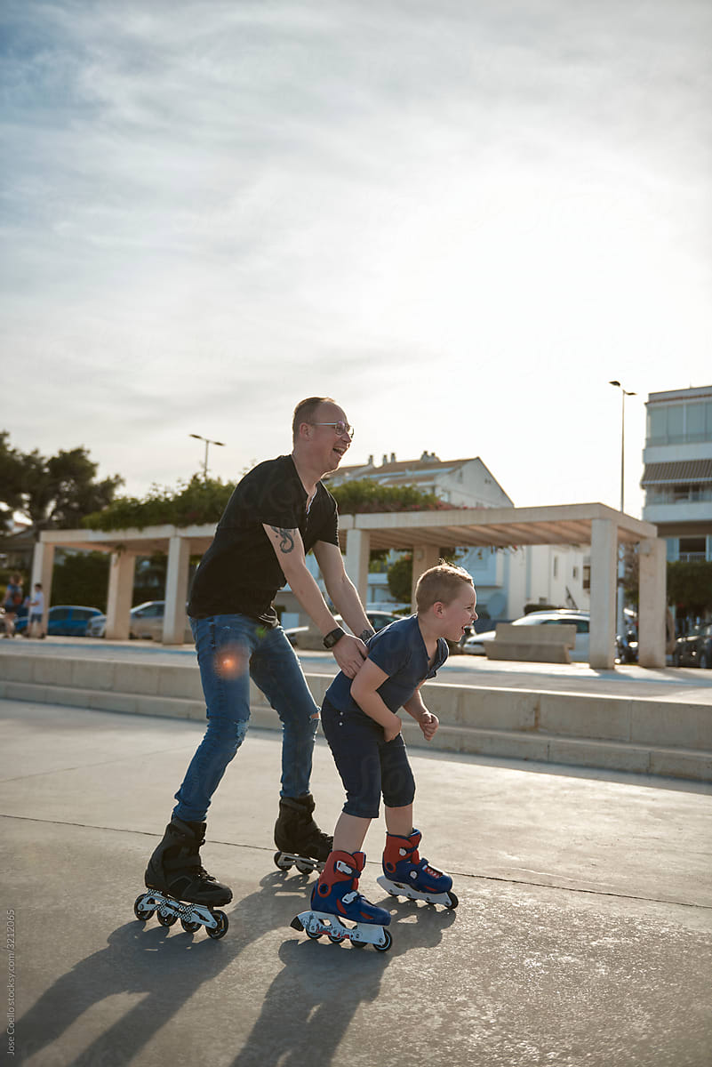 Father and son with roller skates