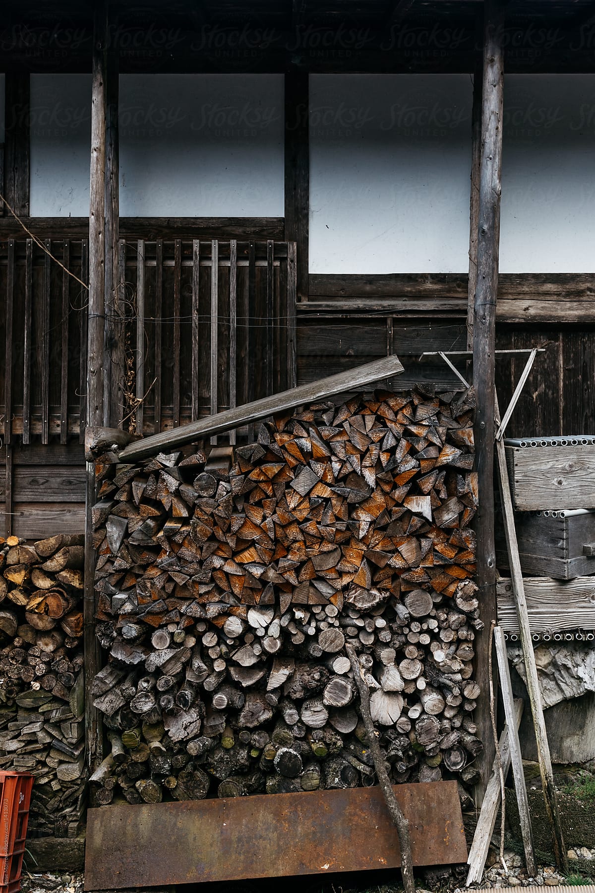 wood stack decor for burning fuel outside traditional japanese home in remote region japan