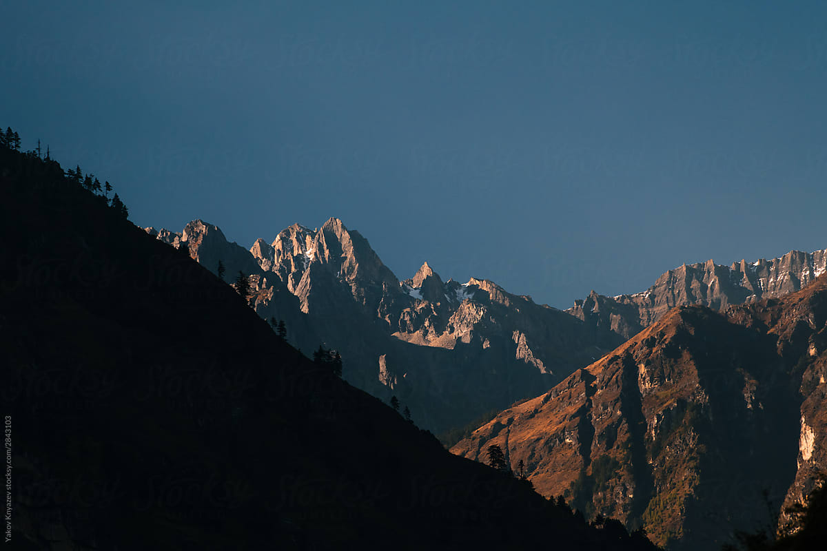Nepalese landscape - mountain slopes and snowy peaks on the background