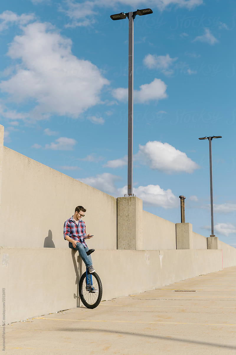 Man Texting on Bicycle