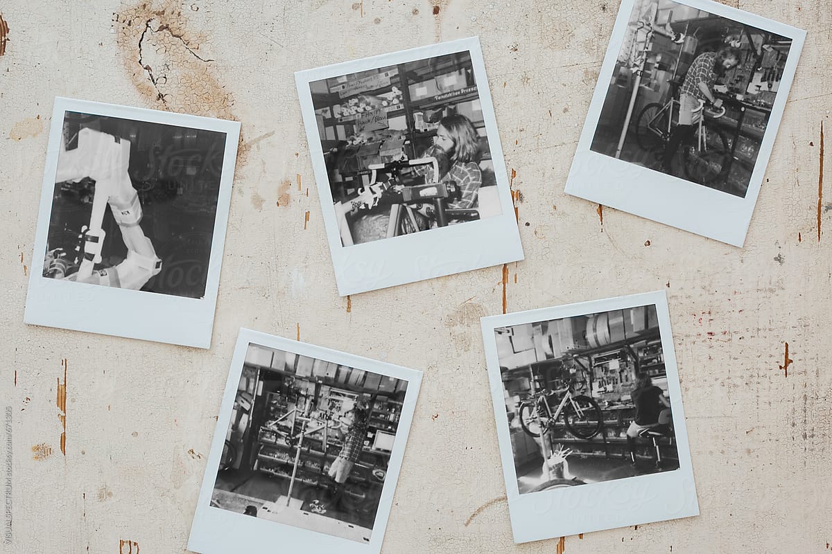 Five Black and White Polaroid Images on Shabby White Tabletop