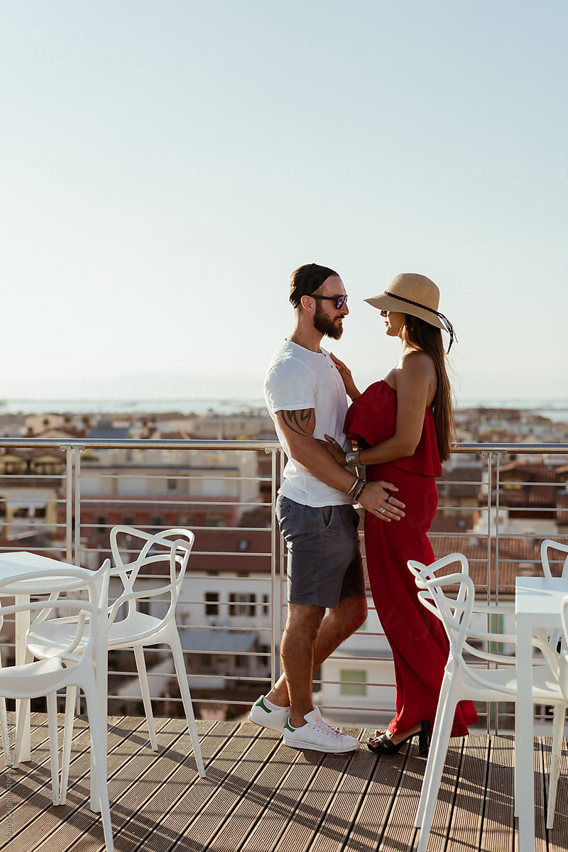 Amazing couple embracing in a rooftop
