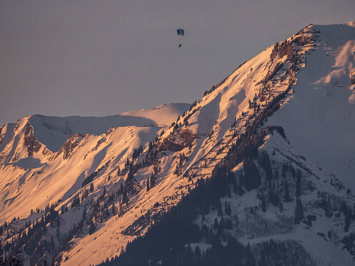Paraglider over winterly mountains - pure freedom!